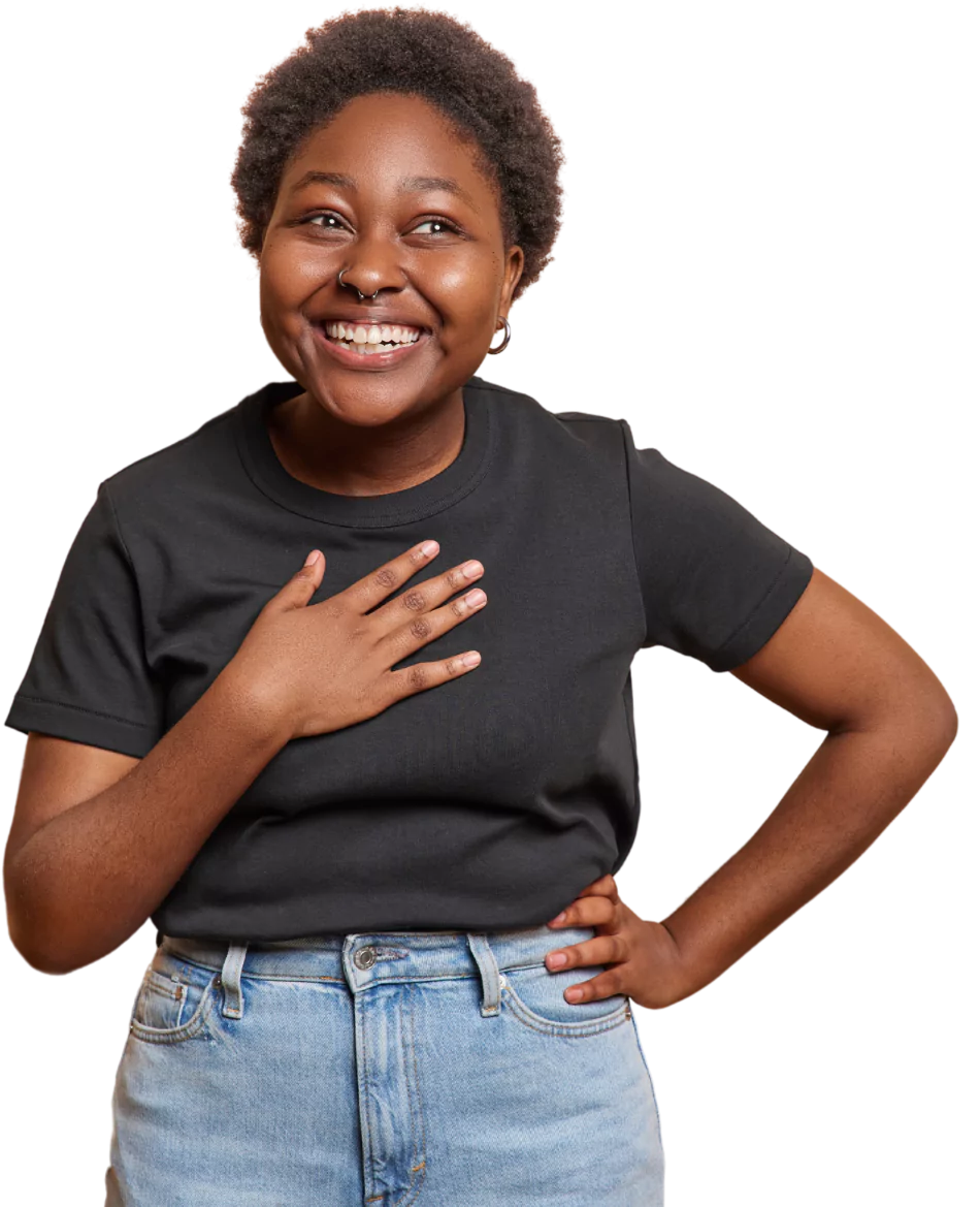 Happy woman standing with hand on heart and smiling